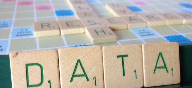 Scrabble pieces spelling "publish research data"